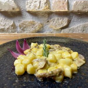 Gnocchetti in crema di zucca con porcini e salsiccia